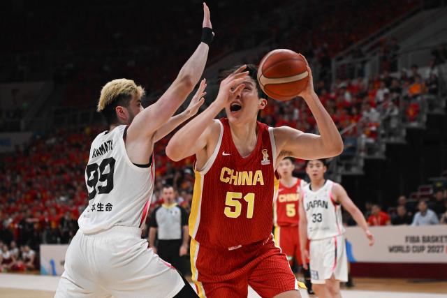China’s Yang Hansen shoots as Japan’s Koya Kawamata blocks during the FIBA Basketball World Cup 2027 Asian Qualifiers game between China and Japan in Shenyang, China’s Liaoning Province on July 3, 2026. (Photo by CN-STR / AFP) / China OUT