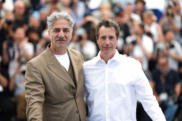 (FILES) French-Armenian actor Simon Abkarian and French director and screenwriter Antonin Baudry pose during a photocall of the film "La Bataille de Gaulle : L'age de fer" (De Gaulle: Tilting Iron) at the 79th edition of the Cannes Film Festival in Cannes, southern France on May 21, 2026. (Photo by Sameer AL-DOUMY / AFP)