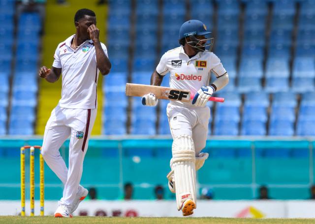 Lahiru Udara (R) of Sri Lanka get runs off by Shamar Joseph (L) of West Indies during day one of the second Test cricket match between West Indies and Sri Lanka at Sir Vivian Richards Stadium in North Sound, Antigua and Barbuda, on July 3, 2026. (Photo by Randy Brooks / AFP)
