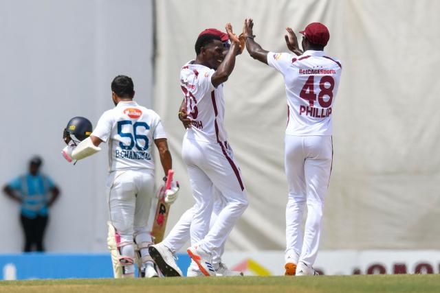Shamar Joseph (2L) of West Indies celebrates the dismissal of Dinesh Chandimal (L) of Sri Lanka during day one of the second Test cricket match between West Indies and Sri Lanka at Sir Vivian Richards Stadium in North Sound, Antigua and Barbuda, on July 3, 2026. (Photo by Randy Brooks / AFP)