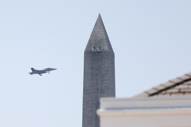 A US Navy F-18F fighter jet flys over Washington, DC, on July 3, 2026, ahead of the upcoming July 4 holiday. (Photo by Jemal COUNTESS / AFP)