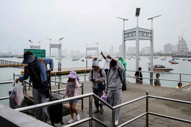 Tourists arrive at a pier in Pattaya on July 3, 2026. (Photo by ANTHONY WALLACE / AFP)