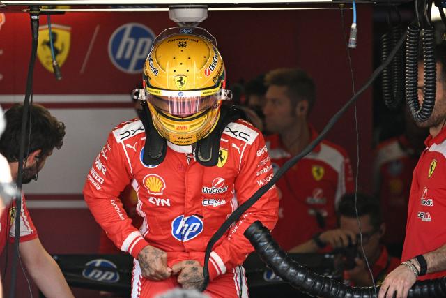 Ferrari's British driver Lewis Hamilton prepares for the sprint qualifying session ahead of the Formula One British Grand Prix at the Silverstone motor racing circuit in Silverstone, central England, on July 3, 2026. (Photo by PETER POWELL / POOL / AFP)