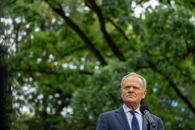 Poland's Prime Minister Donald Tusk speaks to the press during a press conference in the gardens of the Prime Minister's Chancellery building in Warsaw on July 3, 2026. (Photo by Wojtek RADWANSKI / AFP)