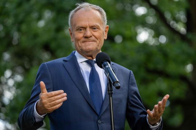 Poland's Prime Minister Donald Tusk speaks to the press during a press conference in the gardens of the Prime Minister's Chancellery building in Warsaw on July 3, 2026. (Photo by Wojtek RADWANSKI / AFP)