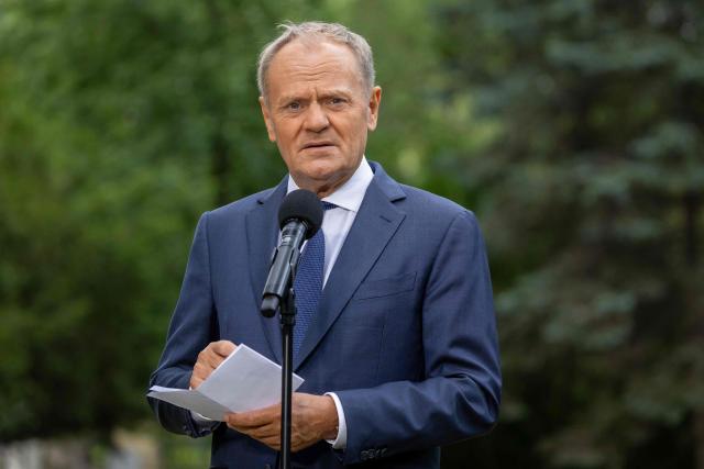 Poland's Prime Minister Donald Tusk speaks to the press during a press conference in the gardens of the Prime Minister's Chancellery building in Warsaw on July 3, 2026. (Photo by Wojtek RADWANSKI / AFP)
