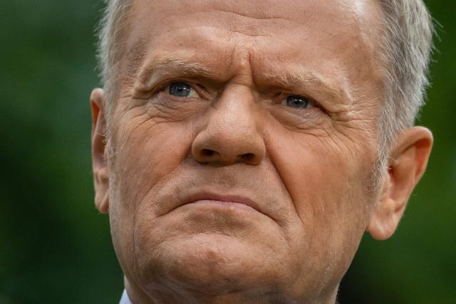 Poland's Prime Minister Donald Tusk speaks to the press during a press conference in the gardens of the Prime Minister's Chancellery building in Warsaw on July 3, 2026. (Photo by Wojtek RADWANSKI / AFP)