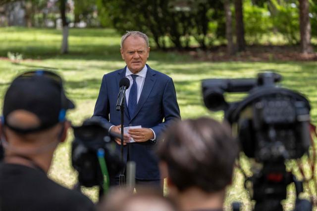 Poland's Prime Minister Donald Tusk speaks to the press during a press conference in the gardens of the Prime Minister's Chancellery building in Warsaw on July 3, 2026. (Photo by Wojtek RADWANSKI / AFP)