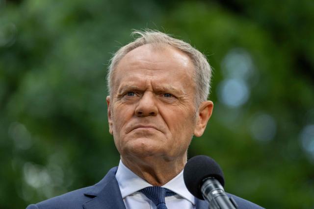 Poland's Prime Minister Donald Tusk speaks to the press during a press conference in the gardens of the Prime Minister's Chancellery building in Warsaw on July 3, 2026. (Photo by Wojtek RADWANSKI / AFP)