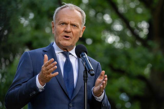 Poland's Prime Minister Donald Tusk speaks to the press during a press conference in the gardens of the Prime Minister's Chancellery building in Warsaw on July 3, 2026. (Photo by Wojtek RADWANSKI / AFP)