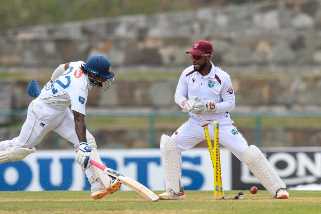Shai Hope (R) of West Indies attempts to run out Lahiru Udara (L) of Sri Lanka during the 1st day of the 2nd Test between Sri Lanka and West Indies at Vivian Richards Cricket Stadium in North Sound, Antigua and Barbuda, on July 3, 2026. (Photo by Randy Brooks / AFP)