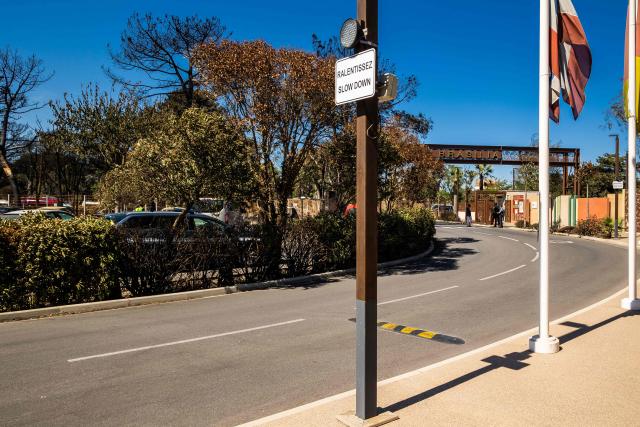 This photograph shows the entrance of the camping 'Le Brasilia', a day after a fire broke out, in Canet-en-Roussillon, southern France on July 3, 2026. Nearly 3,000 people had to be evacuated from several campsites, as well as from businesses and several municipalities, after a fire broke out in Sainte-Marie-la-Mer and spread on to Canet-en-Roussillon, affecting the watersports hub, firefighters and the prefect of Pyrenees-Orientales said on July 2, 2026. (Photo by Jean-Christophe MILHET / AFP)