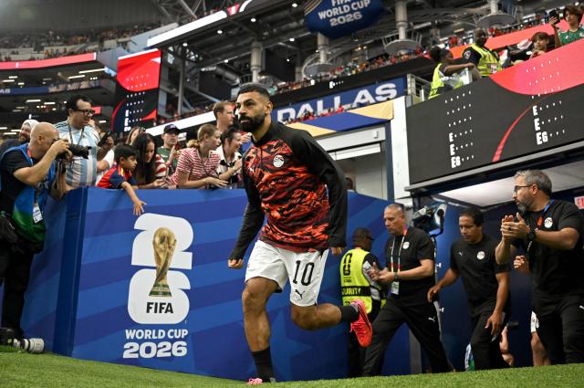 Egypt's forward #10 Mohamed Salah enters the pitch for warm up prior to the 2026 World Cup round of 32 football match between Australia and Egypt at the Dallas Stadium in Arlington on July 3, 2026.  (Photo by Paul ELLIS / AFP)