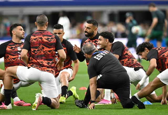Egypt's forward #10 Mohamed Salah (C) speaks with teammates during warm up prior to the 2026 World Cup round of 32 football match between Australia and Egypt at the Dallas Stadium in Arlington on July 3, 2026.  (Photo by Paul ELLIS / AFP)