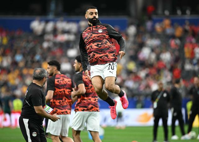 Egypt's forward #10 Mohamed Salah jumps during warm up prior to the 2026 World Cup round of 32 football match between Australia and Egypt at the Dallas Stadium in Arlington on July 3, 2026.  (Photo by Paul ELLIS / AFP)