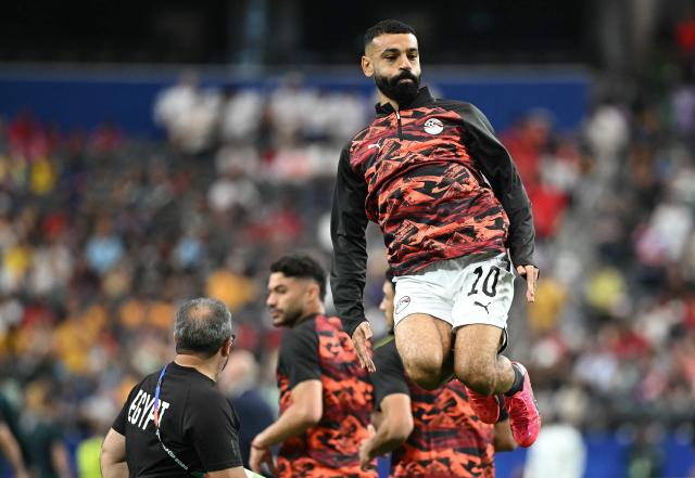 Egypt's forward #10 Mohamed Salah jumps during warm up prior to the 2026 World Cup round of 32 football match between Australia and Egypt at the Dallas Stadium in Arlington on July 3, 2026.  (Photo by Paul ELLIS / AFP)