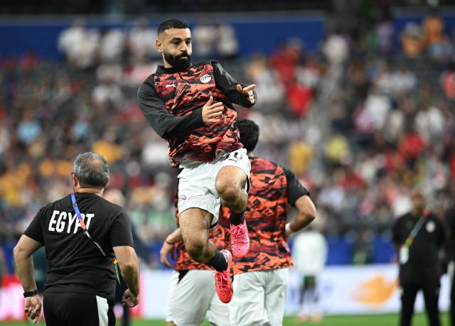 Egypt's forward #10 Mohamed Salah jumps during warm up prior to the 2026 World Cup round of 32 football match between Australia and Egypt at the Dallas Stadium in Arlington on July 3, 2026.  (Photo by Paul ELLIS / AFP)