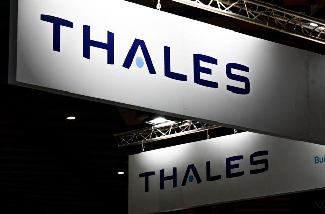 (FILES) This photograph shows the 'Thales' logo at the International Cybersecurity Forum (FIC) in Lille, northern France, on September 7, 2021. The French technology and defense group Thales announced on July 3, 2026, that it expects to book an exceptional charge of around 450 million euros in the first half of 2026, as a direct consequence of Germany’s decision to scrap its large F126 frigate program. (Photo by DENIS CHARLET / AFP)