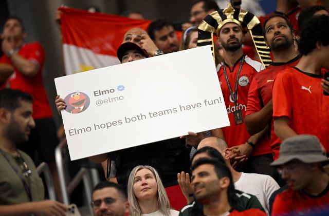 An Egypt supporter holds placard depicting a social media post prior to the 2026 World Cup round of 32 football match between Australia and Egypt at the Dallas Stadium in Arlington on July 3, 2026.  (Photo by Paul ELLIS / AFP)