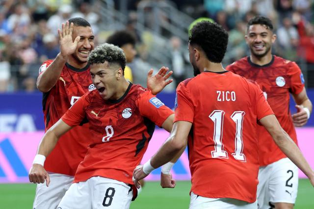 Egypt's midfielder #08 Emam Ashour (L) celebrates with teammates  after scoring the opening goal during the 2026 World Cup round of 32 football match between Australia and Egypt at the Dallas Stadium in Arlington on July 3, 2026.  (Photo by Thomas COEX / AFP)