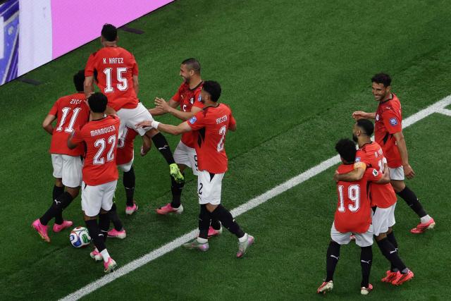 Egypt's midfielder #08 Emam Ashour (3rd L, hidden) celebrates with teammates after scoring the opening goal during the 2026 World Cup round of 32 football match between Australia and Egypt at the Dallas Stadium in Arlington on July 3, 2026.  (Photo by Aric Becker / AFP)