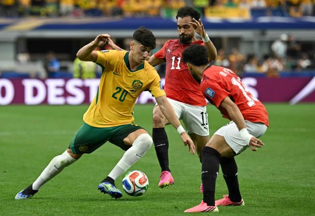 Australia's forward #20 Cristian Volpato (L) fights for the ball with Egypt's midfielder #11 Mostafa Ziko (C) during the 2026 World Cup round of 32 football match between Australia and Egypt at the Dallas Stadium in Arlington on July 3, 2026.  (Photo by Paul ELLIS / AFP)