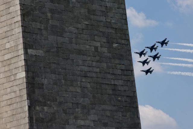 A US Air Force Thunderbirds demonstration squadron fly over the National Mall near the Washington Monument in Washington, DC, on July 3, 2026, ahead of the upcoming July 4 holiday. (Photo by Amid FARAHI / AFP)