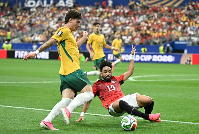 Australia's defender #05 Jordan Bos (up) is tackled by Egypt's midfielder #19 Marwan Attia  during the 2026 World Cup round of 32 football match between Australia and Egypt at the Dallas Stadium in Arlington on July 3, 2026.  (Photo by Paul ELLIS / AFP)