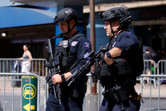 Police officers provide security outside Madison Square Garden, the reported venue for the wedding celebrations of pop singer Taylor Swift and pro-athlete Travis Kelce, in New York City on July 3, 2026. Swift and Kelce's official wedding plans are tightly under wraps, but New York is bracing to host the celebrity marriage of the year this week at Madison Square Garden. The wedding will reportedly take place Friday with a star-studded guest list of around 1,000, including models Gigi Hadid and Cara Delevingne, singer Selena Gomez, and actress Zoe Kravitz -- all known to be close Swift pals -- and Kelce's Kansas City Chiefs teammates. (Photo by Leonardo MUNOZ / AFP)