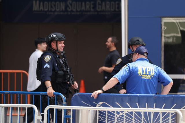 Police officers stand outside Madison Square Garden, the reported venue for the wedding celebrations of pop singer Taylor Swift and pro-athlete Travis Kelce, in New York City on July 3, 2026. Swift and Kelce's official wedding plans are tightly under wraps, but New York is bracing to host the celebrity marriage of the year this week at Madison Square Garden. The wedding will reportedly take place Friday with a star-studded guest list of around 1,000, including models Gigi Hadid and Cara Delevingne, singer Selena Gomez, and actress Zoe Kravitz -- all known to be close Swift pals -- and Kelce's Kansas City Chiefs teammates. (Photo by CHARLY TRIBALLEAU / AFP)
