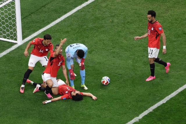 Egypt's defender #03 Mohamed Hany (C) reacts on the ground  during the 2026 World Cup round of 32 football match between Australia and Egypt at the Dallas Stadium in Arlington on July 3, 2026.  (Photo by Aric Becker / AFP)