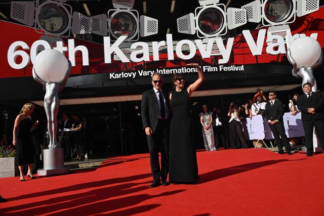 US actress Maggie Gyllenhaal and her husband US actor Peter Sarsgaard poses on the red carpet during the opening of the 60th Karlovy Vary International Film Festival (KVIFF) in Karlovy Vary, Czech Republic on July 3, 2026. (Photo by Michal Cizek / AFP)