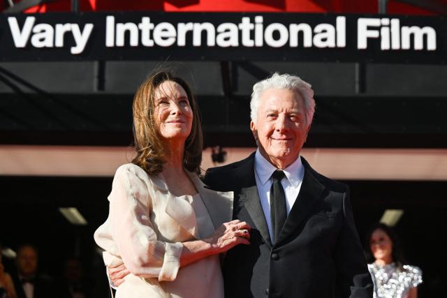 US actor Dustin Hoffman and his wife Lisa pose on the red carpet as they arrive for the opening of the 60th Karlovy Vary International Film Festival (KVIFF) in Karlovy Vary, Czech Republic on July 3, 2026. (Photo by Michal Cizek / AFP)
