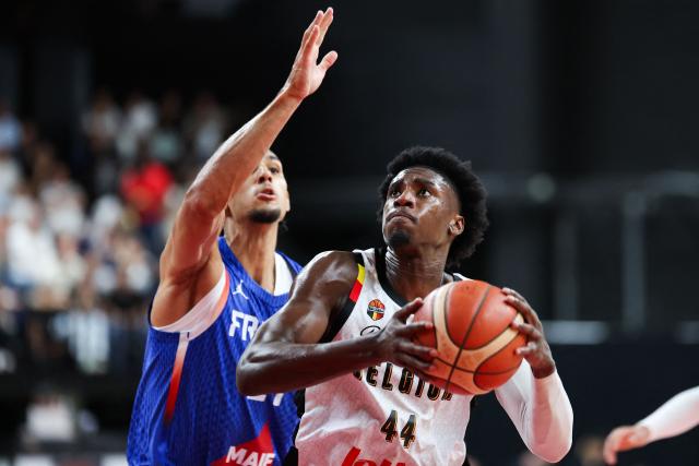 France's Neal Sako (L) and Belgium's Mamadou Guisse fight for the ball during a qualifier basketball match between Belgium and France for the men's 2027 FIBA World Championships in Antwerp, on July 3, 2026. (Photo by VIRGINIE LEFOUR / Belga / AFP) / Belgium OUT