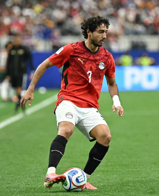 Egypt's defender #03 Mohamed Hany runs with the ball during the 2026 World Cup round of 32 football match between Australia and Egypt at the Dallas Stadium in Arlington on July 3, 2026.  (Photo by Paul ELLIS / AFP)