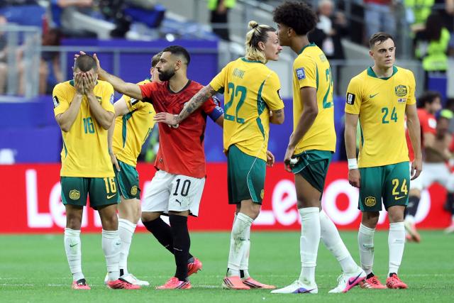 Egypt's forward #10 Mohamed Salah (2nd L) reacts with Australia's players after winning the  2026 World Cup round of 32 football match between Australia and Egypt at the Dallas Stadium in Arlington on July 3, 2026.  (Photo by Thomas COEX / AFP)