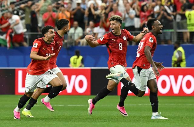 Egypt's players celebrate after winning the 2026 World Cup round of 32 football match between Australia and Egypt at the Dallas Stadium in Arlington on July 3, 2026.  (Photo by Paul ELLIS / AFP)