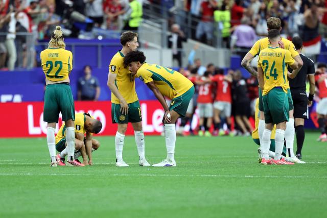Australia's players react after losing the 2026 World Cup round of 32 football match between Australia and Egypt at the Dallas Stadium in Arlington on July 3, 2026.  (Photo by Thomas COEX / AFP)