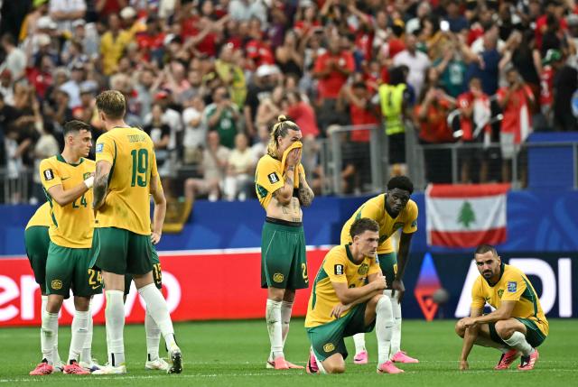 Australia's players react after losing the 2026 World Cup round of 32 football match between Australia and Egypt at the Dallas Stadium in Arlington on July 3, 2026.  (Photo by Paul ELLIS / AFP)