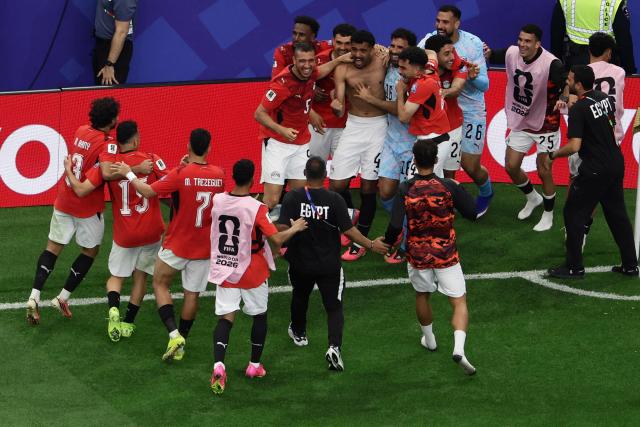 Egypt's players celebrate after winning the 2026 World Cup round of 32 football match between Australia and Egypt at the Dallas Stadium in Arlington on July 3, 2026.  (Photo by Aric Becker / AFP)