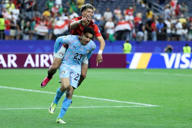TOPSHOT - Egypt's goalkeeper #23 Mostafa Shoubir (L) and Egypt's midfielder #08 Emam Ashour celebrate after winning the 2026 World Cup round of 32 football match between Australia and Egypt at the Dallas Stadium in Arlington on July 3, 2026.  (Photo by Thomas COEX / AFP)