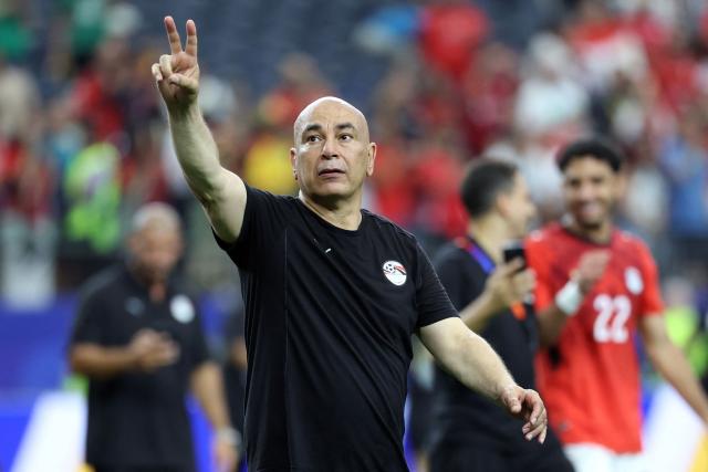 Egypt's head coach Hossam Hassan celebrates after winning the 2026 World Cup round of 32 football match between Australia and Egypt at the Dallas Stadium in Arlington on July 3, 2026.  (Photo by Thomas COEX / AFP)