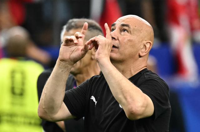 Egypt's head coach Hossam Hassan celebrates after winning the 2026 World Cup round of 32 football match between Australia and Egypt at the Dallas Stadium in Arlington on July 3, 2026.  (Photo by Paul ELLIS / AFP)