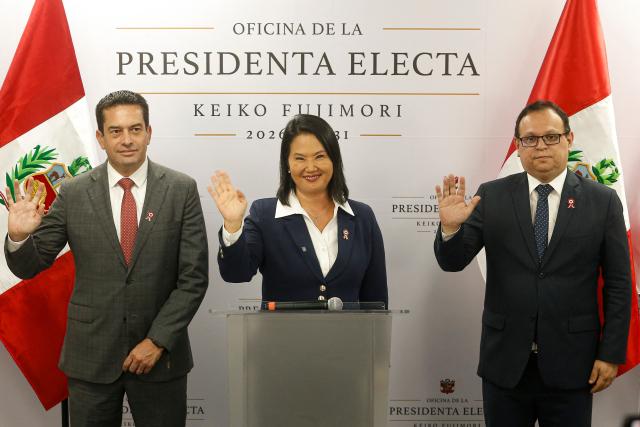 Peru's president-elect for the Fuerza Popular party, Keiko Fujimori (C), waves as she gives a statement alongside her second vice-president Miki Torres (L) and Marco Vinelli, head of the transition team, at her campaign headquarters in the San Borja district of Lima on July 3, 2026. Peru's conservative president-elect Keiko Fujimori vowed to restore "order and hope" as final results showed she narrowly won the election in the latest victory for a resurgent Latin American right. (Photo by AFP)