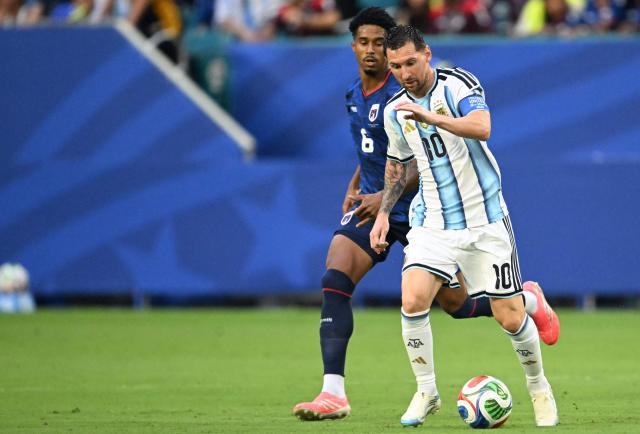Cape Verde's midfielder #06 Kevin Pina and Argentina's forward #10 Lionel Messi fight for the ball during the 2026 World Cup round of 32 football match between Argentina and Cape Verde at the Miami Stadium in Miami Gardens on July 3, 2026.  (Photo by ROBERTO SCHMIDT / AFP)