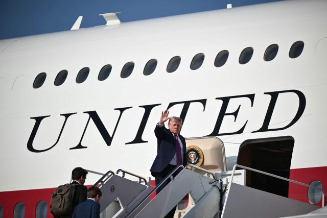 US President Donald Trump waves as he boards Air Force One before departing Joint Base Andrews, Maryland, on July 3, 2026. Trump is heading to South Dakota where he will deliver remarks at Mt. Rushmore. (Photo by Mandel NGAN / AFP)