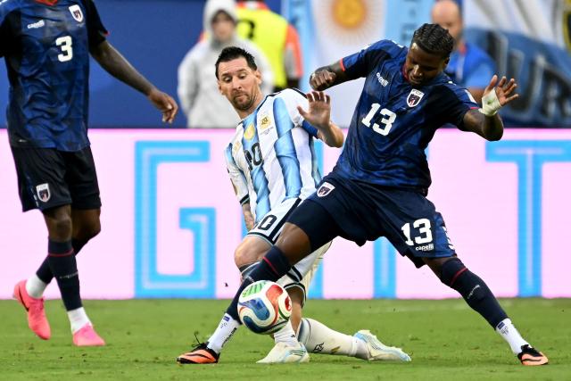 Argentina's forward #10 Lionel Messi and Cape Verde's defender #13 Sidney Lopes Cabral fight for the ball during the 2026 World Cup round of 32 football match between Argentina and Cape Verde at the Miami Stadium in Miami Gardens on July 3, 2026.  (Photo by CHANDAN KHANNA / AFP)