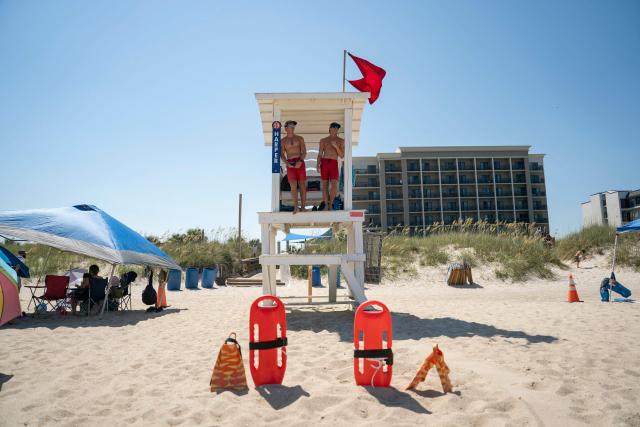 Lifeguards work on the beach during a heatwave in Carolina Beach, North Carolina, on July 3, 2026. Blistering temperatures and humidity has gripped swaths of the United States this week, with more to come for the densely populated East Coast as the nation co-hosts the World Cup and prepares to celebrate its 250th birthday on July 4. The heat wave that has been broiling the Midwest is intensifying in the Northeast, with temperatures surpassing 100F (38C) in cities including New York, Philadelphia and Washington. (Photo by Allison Joyce / AFP)