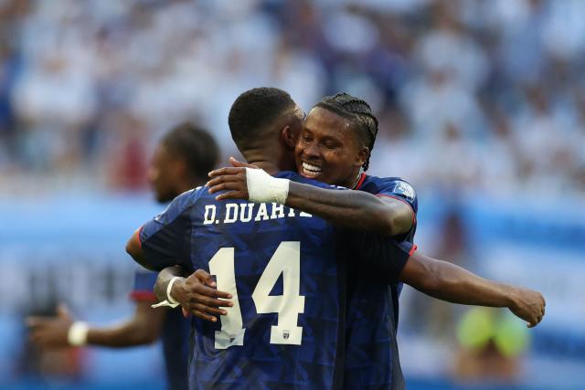 Cape Verde's midfielder #14 Deroy Duarte celebrates with teammate Cape Verde's defender #13 Sidney Lopes Cabral scoring his team's first goal during the 2026 World Cup round of 32 football match between Argentina and Cape Verde at the Miami Stadium in Miami Gardens on July 3, 2026.  (Photo by PATRICIA DE MELO MOREIRA / AFP)