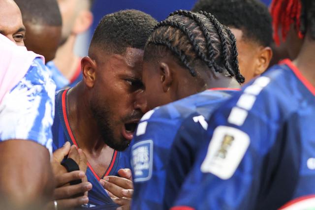 Cape Verde's midfielder #14 Deroy Duarte celebrates with teammate Cape Verde's defender #13 Sidney Lopes Cabral scoring his team's first goal during the 2026 World Cup round of 32 football match between Argentina and Cape Verde at the Miami Stadium in Miami Gardens on July 3, 2026.  (Photo by PATRICIA DE MELO MOREIRA / AFP)